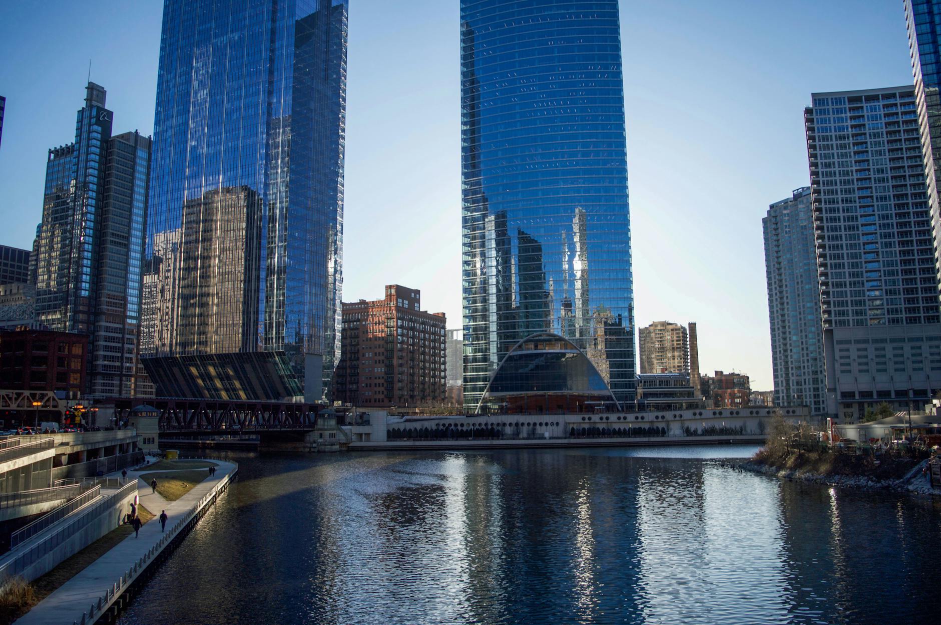 Chicago's modern architecture reflected on the river by day