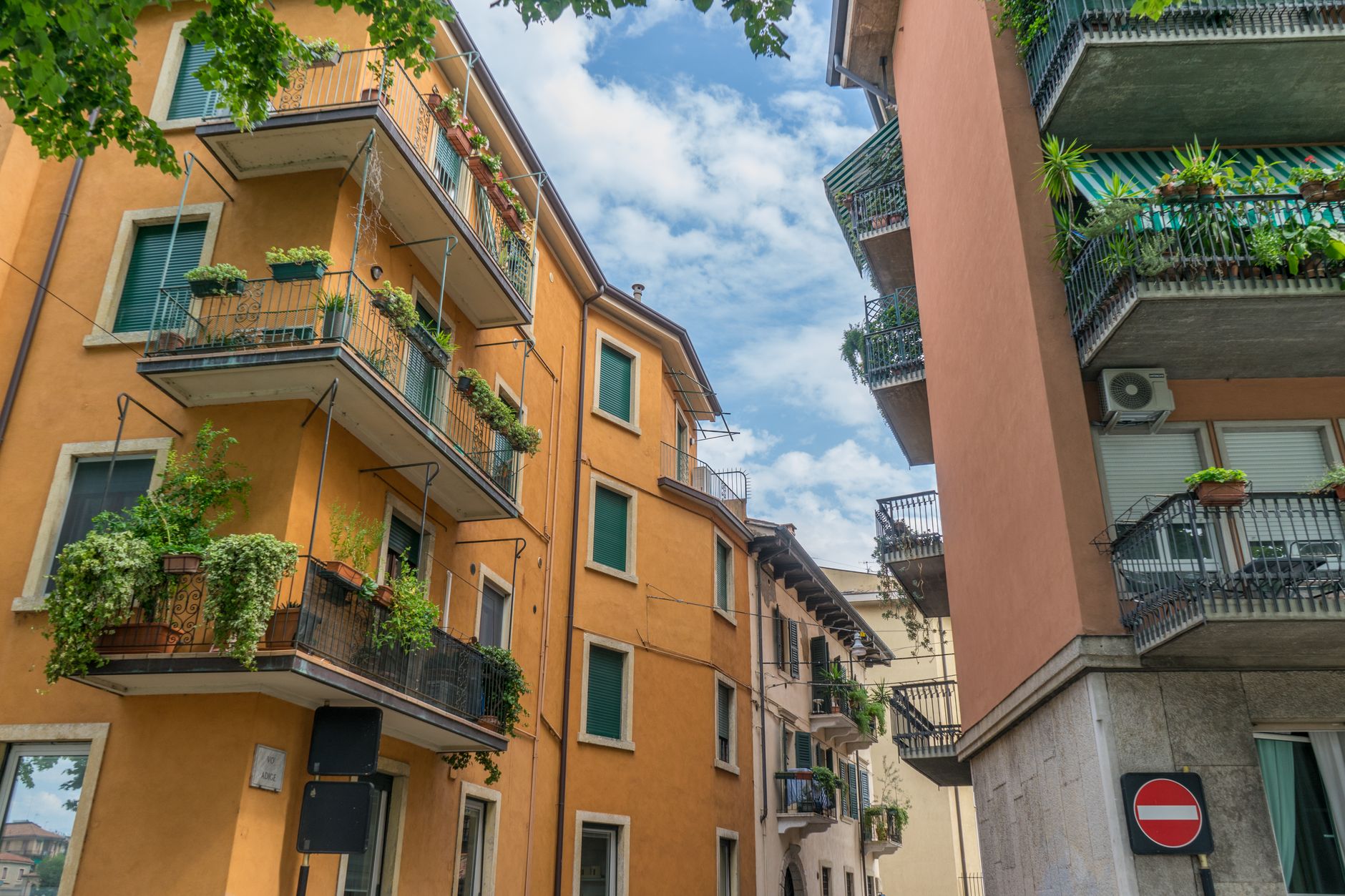 City residential buildings with balconies on a sunny summer day