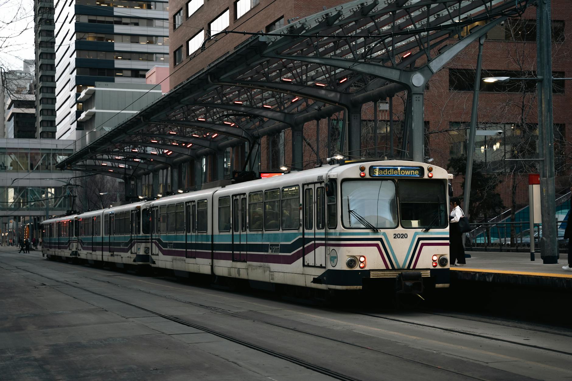 A commuter train at a downtown city station