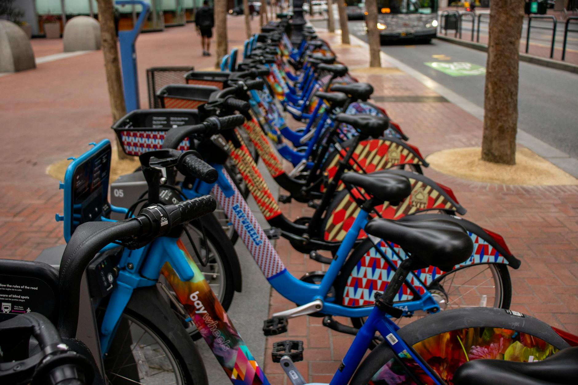 A row of bike-share bicycles parked at an outdoor station