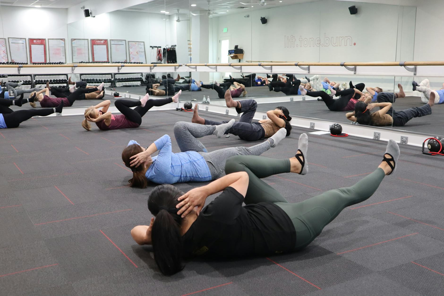 A group fitness class working out indoors