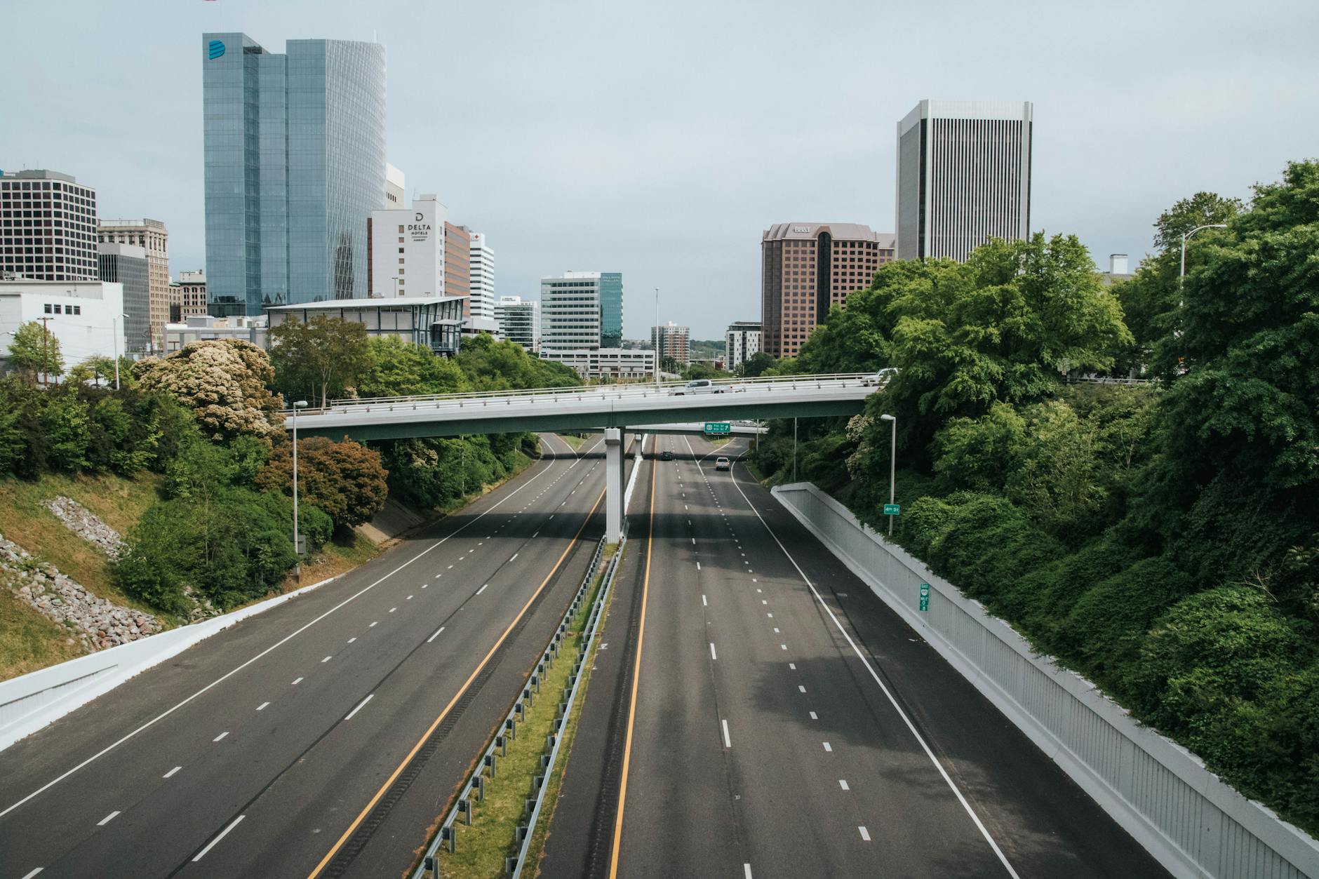 A highway leading toward a city skyline