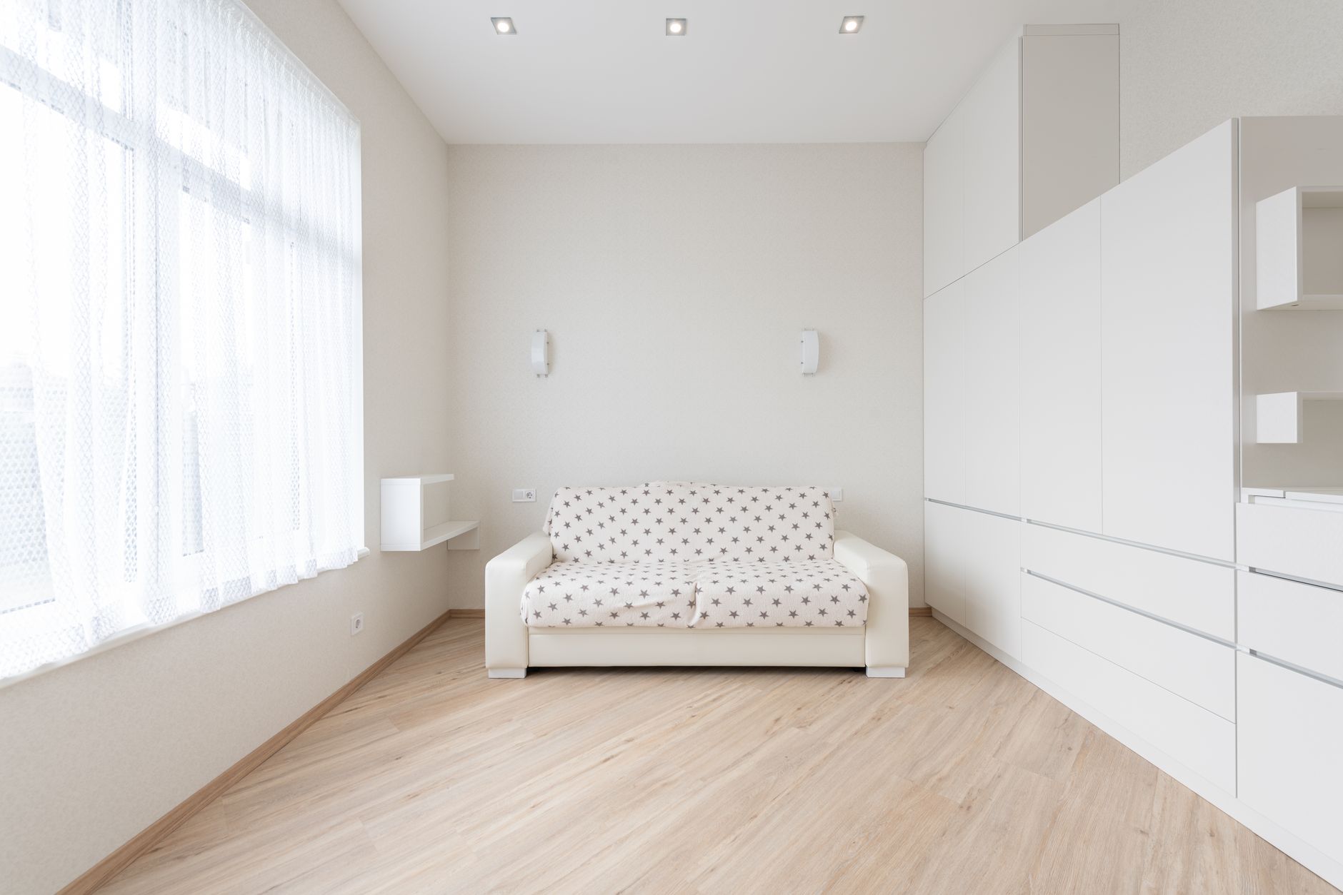 A bright, minimalist living room in a modern apartment