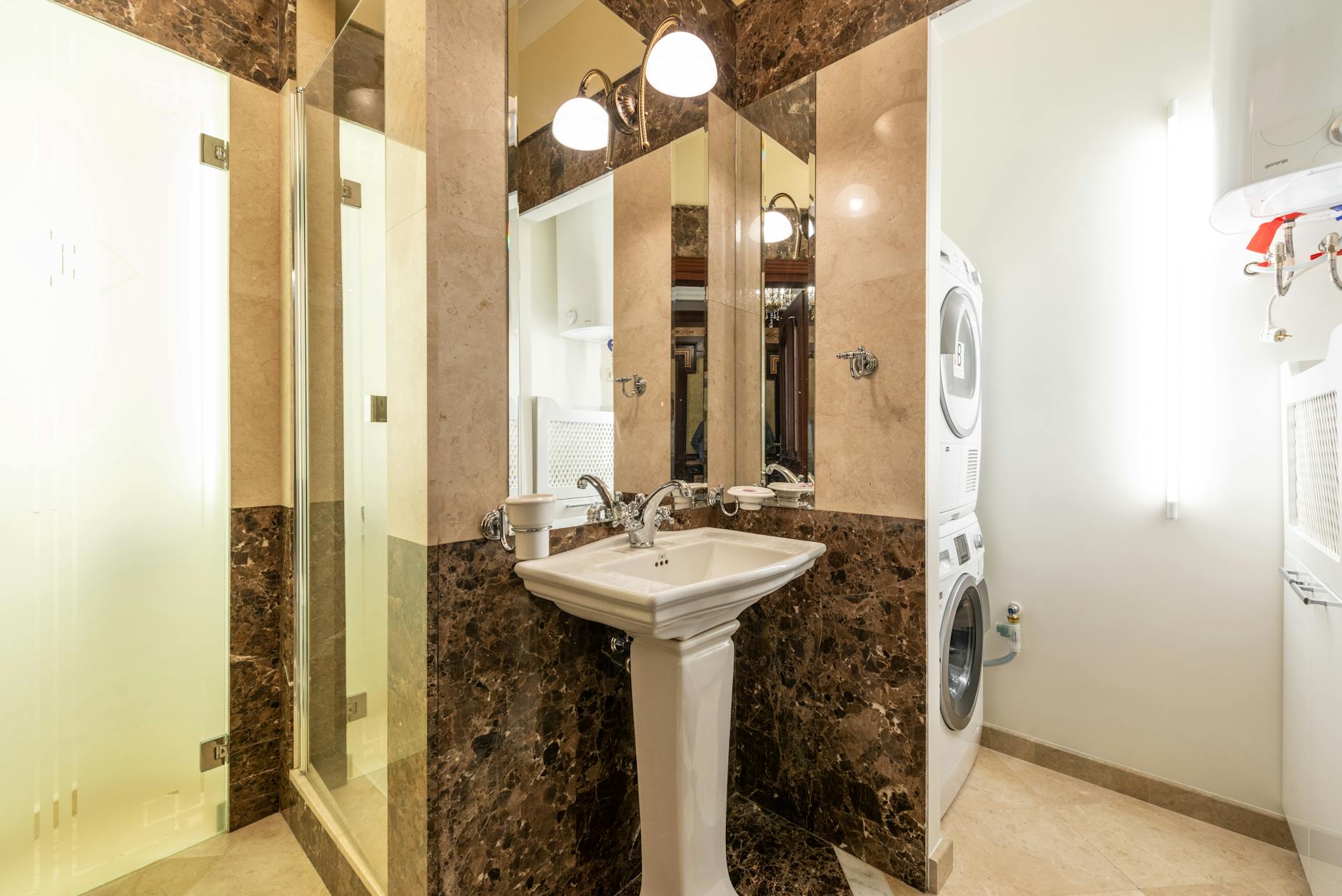 A modern apartment interior with an in-unit washer and dryer