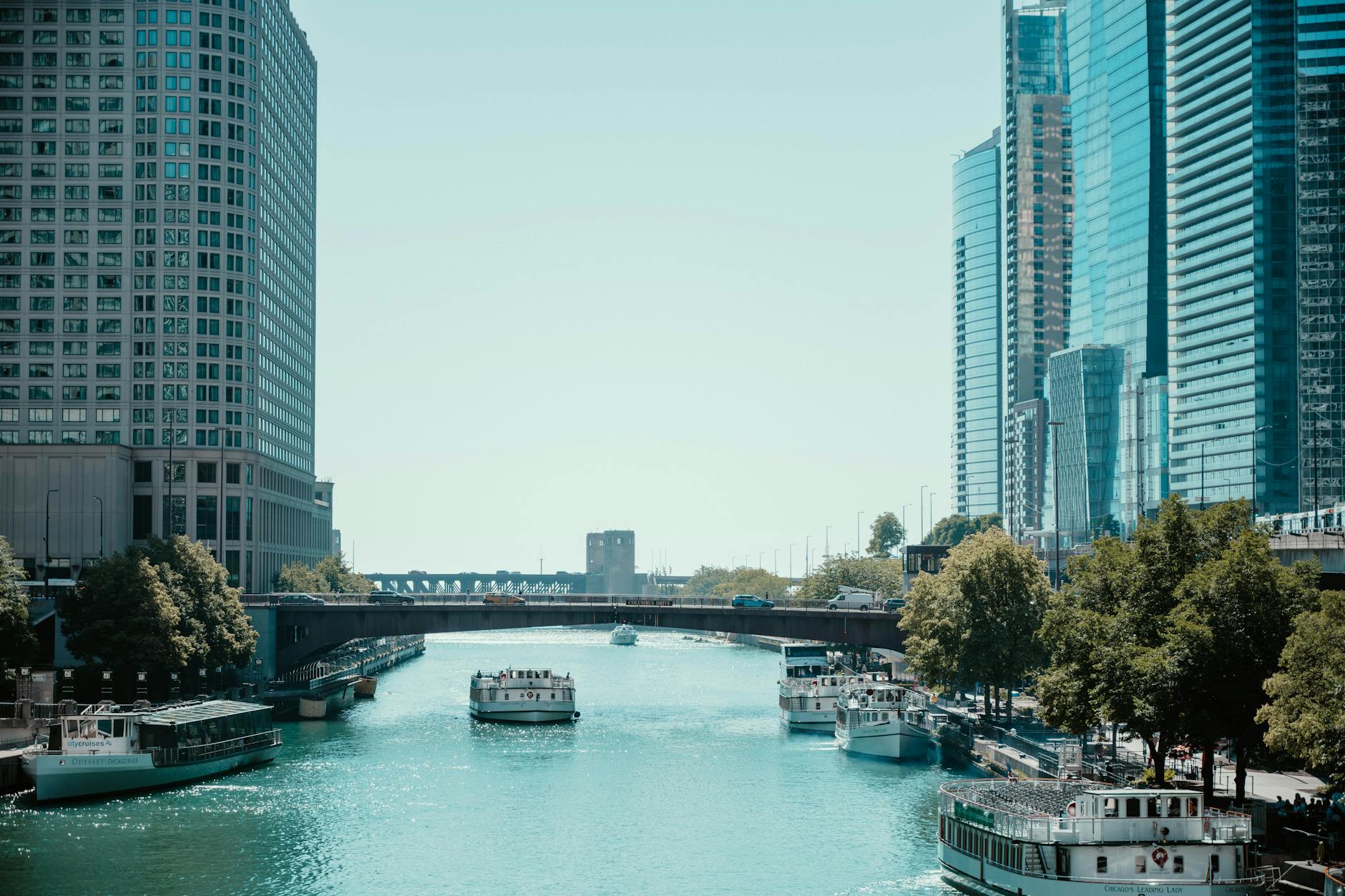 The Chicago River surrounded by skyscrapers on a sunny day