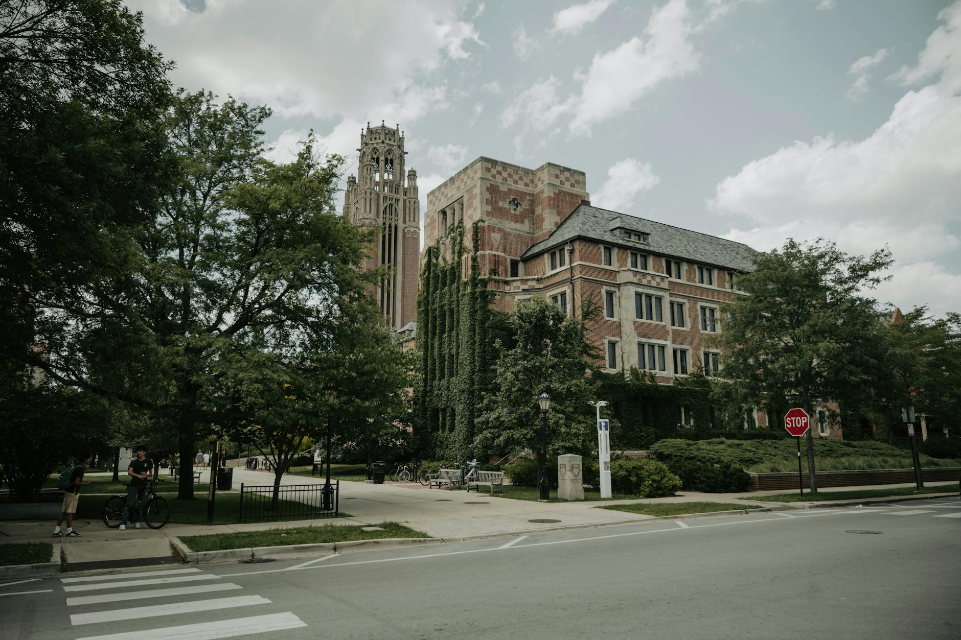 An ivy-covered historic building under a cloudy sky