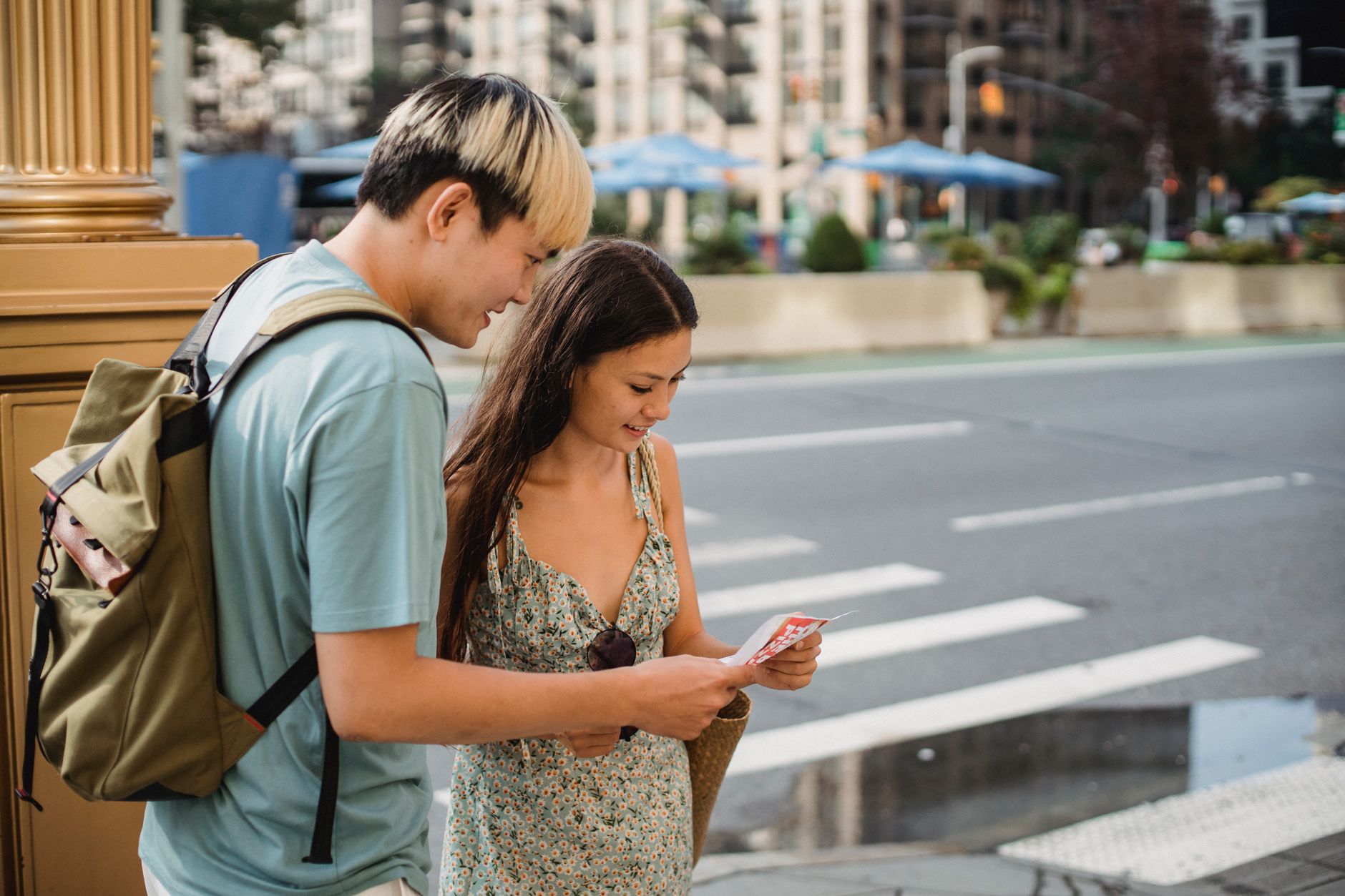 A couple checking a map on a city street