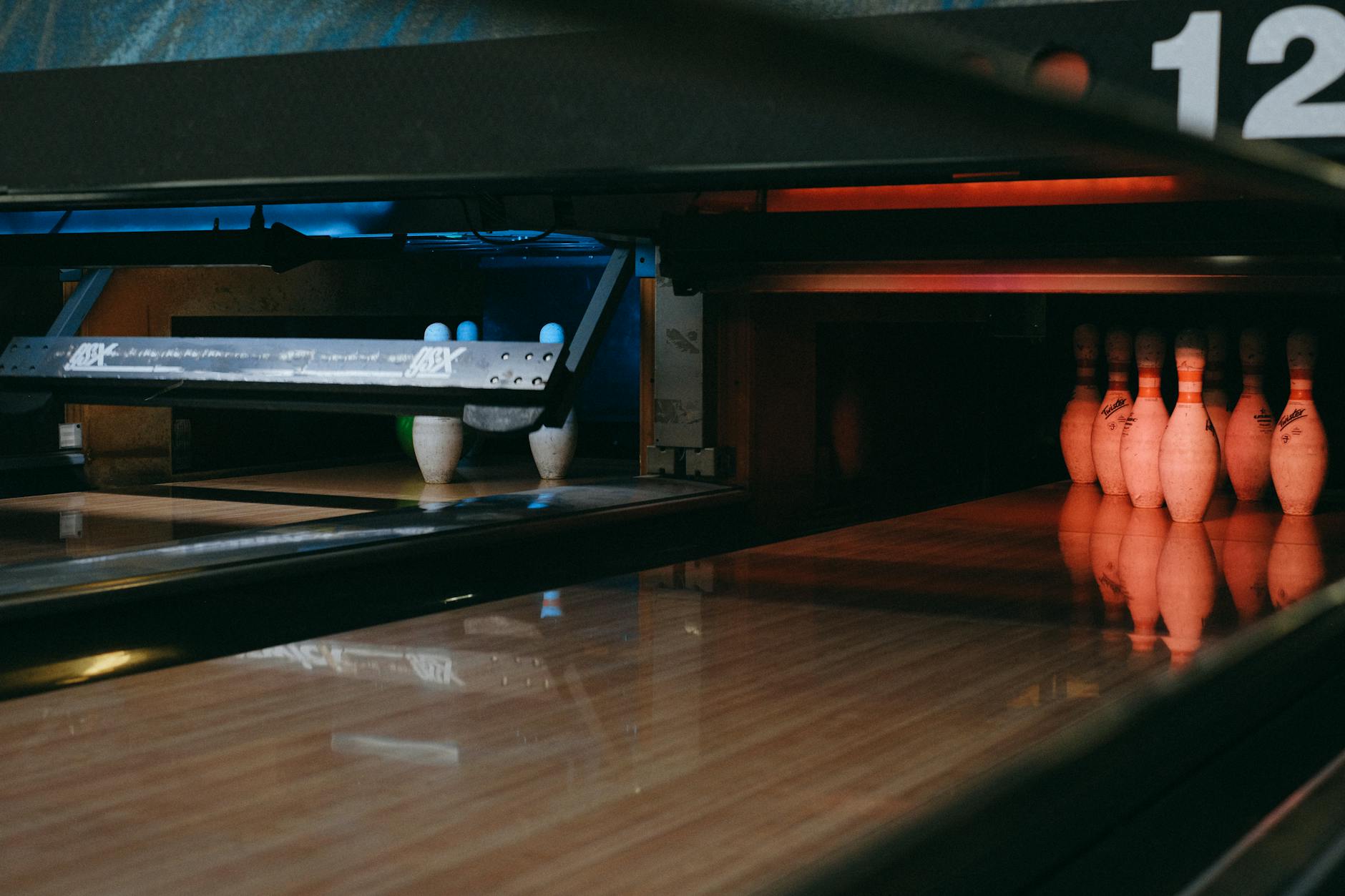 Bowling pins set up at the end of a lane
