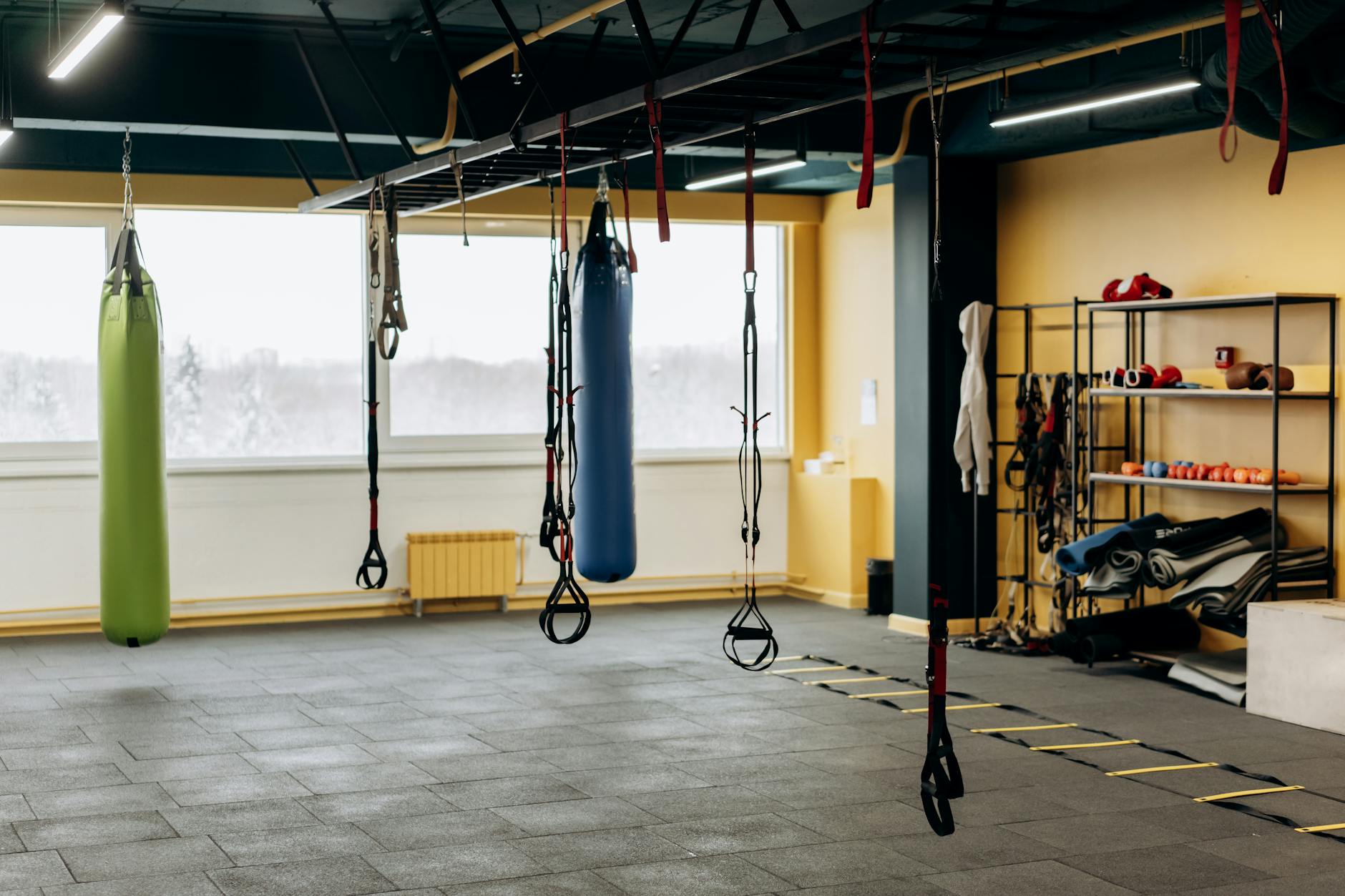 A modern gym with equipment and open space for workouts