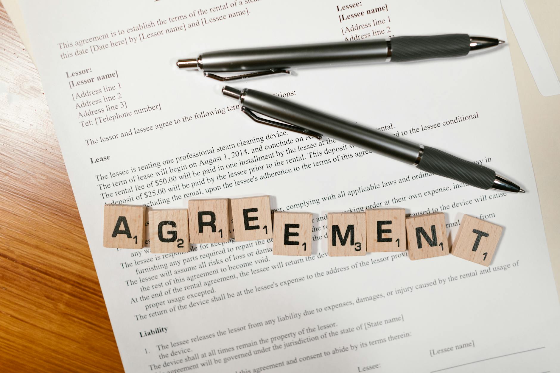A lease agreement document with pens, ready for signing