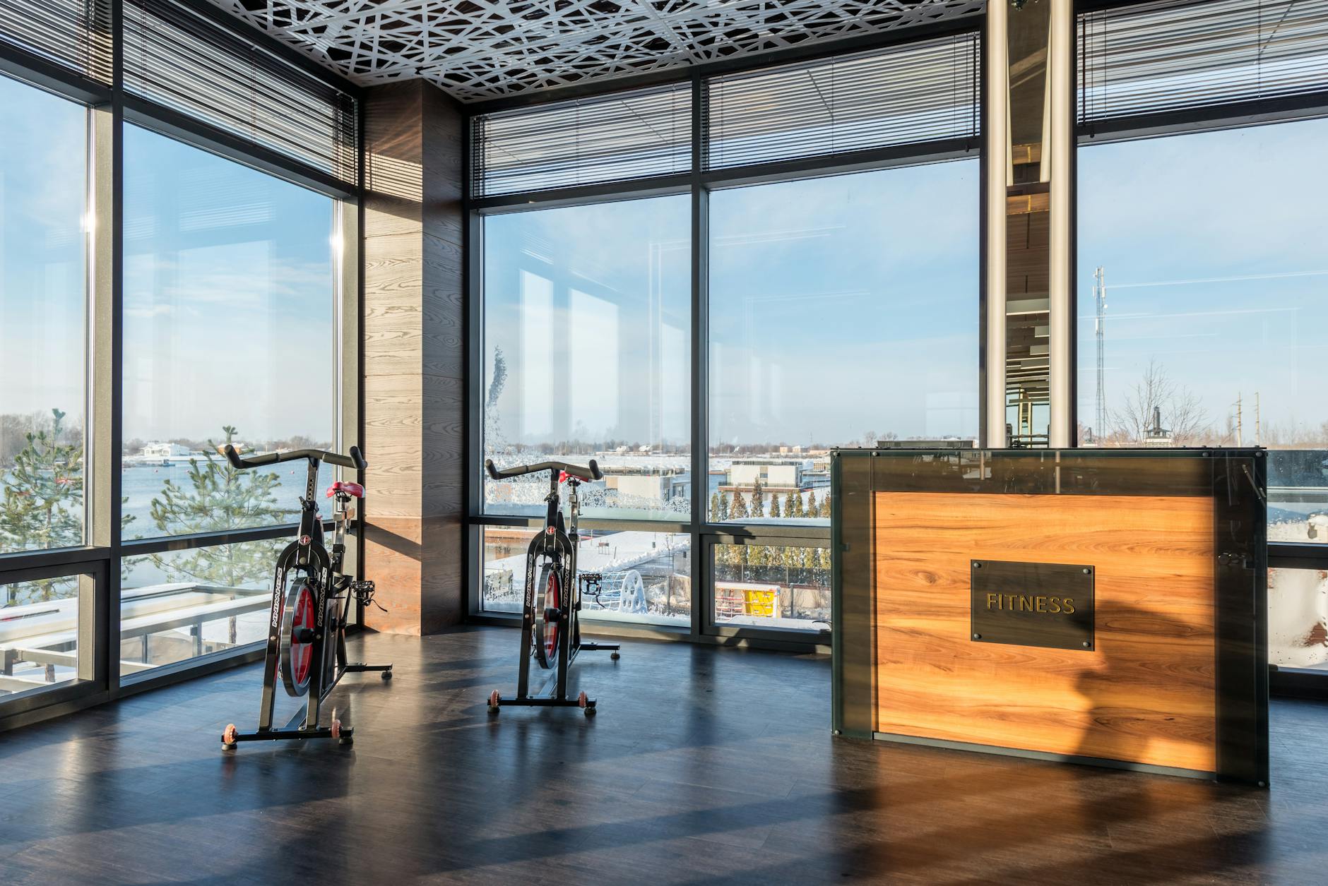Indoor cycling bikes lined up in a bright studio
