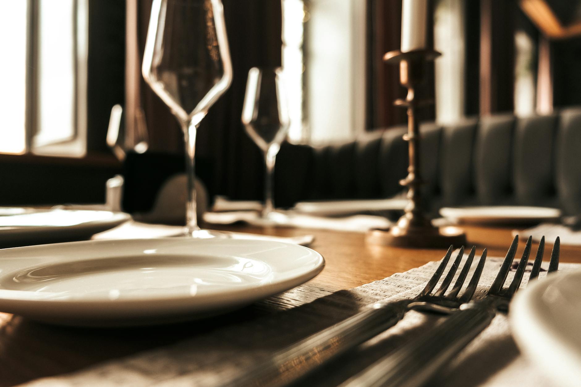 An elegant restaurant table setting in a warm dining room