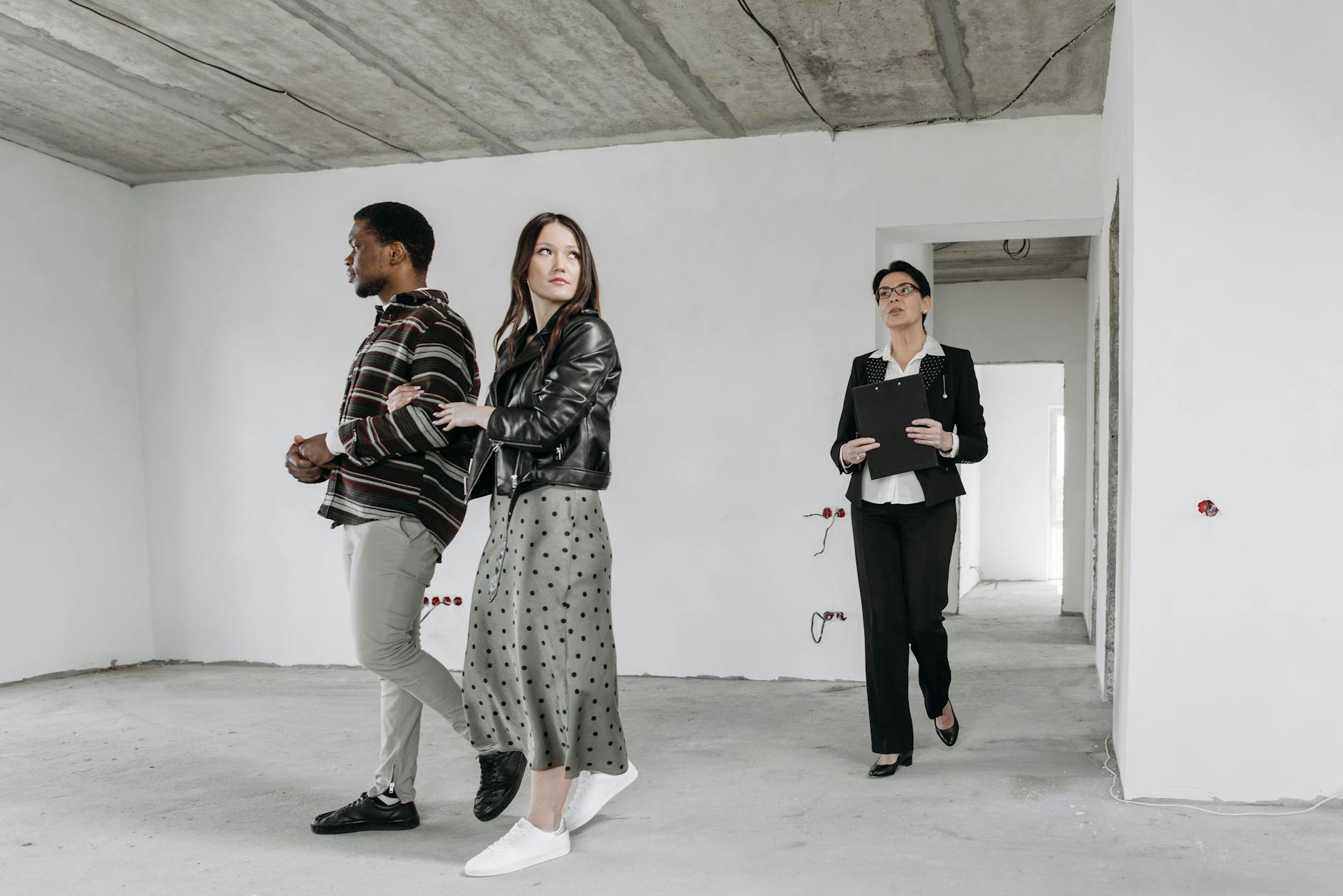 A couple touring a modern apartment interior